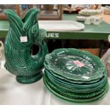 A selection of green majolica type dessert plates by Wedgwood, etc.; a similar vase and a gurgle jug