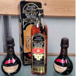 A 700 ml bottle of Bushmills Black Bush Irish whiskey, in tin; 2 miniature bottles of Moët & Chandon