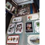 Three vintage postcard albums containing nearly 300 cards