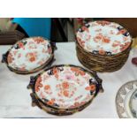 A 16 piece Japan pattern dessert service by Royal Crown Derby comprising 12 plates and 2 pairs of