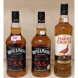 Two 70 cl bottles of "Whyte & Mackay" whisky; a 70 cl bottle of "Famous Grouse" whisky