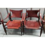 A pair of safari chairs in wood and tan leather with studded incised decoration