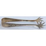 A hallmarked silver pair of sugar tongs, Sheffield 1899, in the form of scaled clawed feet.