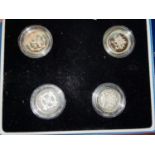 GB: a cased set of 4 piedfort silver £1 coins 1999 - 2003