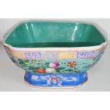 A Chinese late 19th/early 20th century squared bowl with turquoise glaze with variously coloured