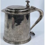 A CHARLES II silver quart flat top tankard with ornate scrollwork thumb piece, slightly tapering