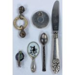 A hallmarked silver rotating pill or snuff box; a Danish teaspoon and knife; miniature mirror etc.