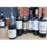 Six bottles of French red wine:  1980 Chateau de Belcier Bordeaux; 1995 Chateau du Hureau Saumur-