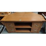 A modern light oak TV stand with 4 drawers, length 108cm x depth 55cm