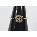 A 9 carat hallmarked gold dress ring with Argyle diamonds in open circular setting, 0.13 carats,