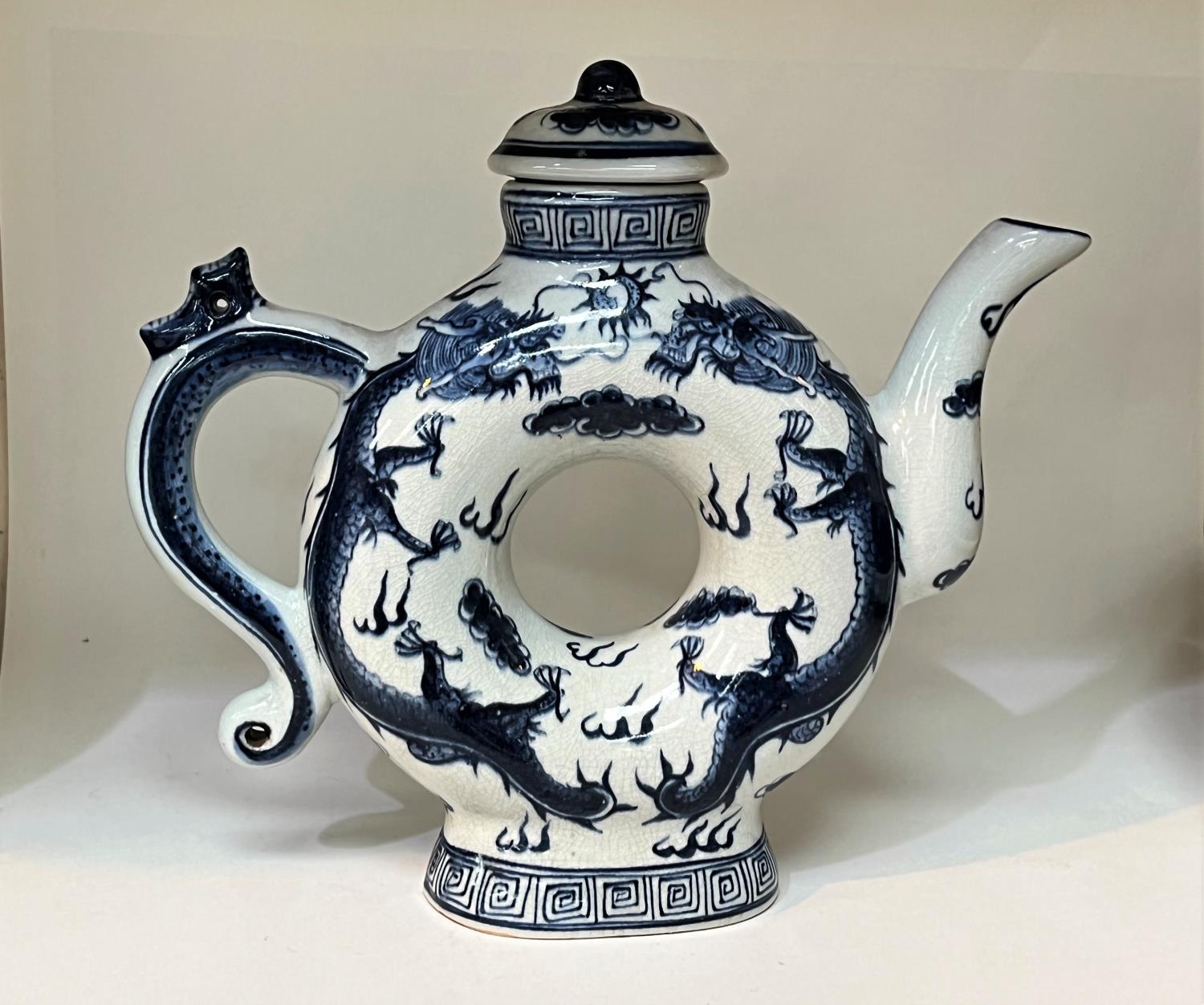 A Chinese blue and white teapot with central hole and 4 character mark to base. Height A Stone - Image 2 of 7