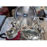 A large circular silver plated tray, a 3 piece silver plated tea service, a large heavy Mappin &