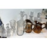 A cut-glass claret jug: two decanters, a set of 6 stirrup/toasting glasses; 2 19th century copper