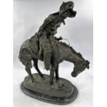 Follower of Fredric Remmington, Cowboy on horse back, bronze, bears signature, marble plinth