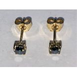 A pair of 9 carat gold, stud earrings, set with blue diamonds 3.6 x 3.3mm, 0.4 carat, sealed