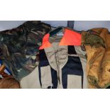 A Columbia Sportswear XXL hunting vest and 3 similar hunting vests