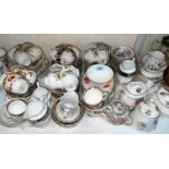 A large selection of mixed teaware cups and saucers