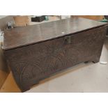A Victorian carved oak coffer with hinged lid