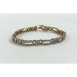 A 9ct gold Art Deco ladies bracelet with diamond set chips, stamped 1 carat in total, stamped on