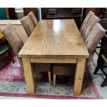 A pine dining suite comprising heavy plank top table on square legs, length 183cm, and a set of 6