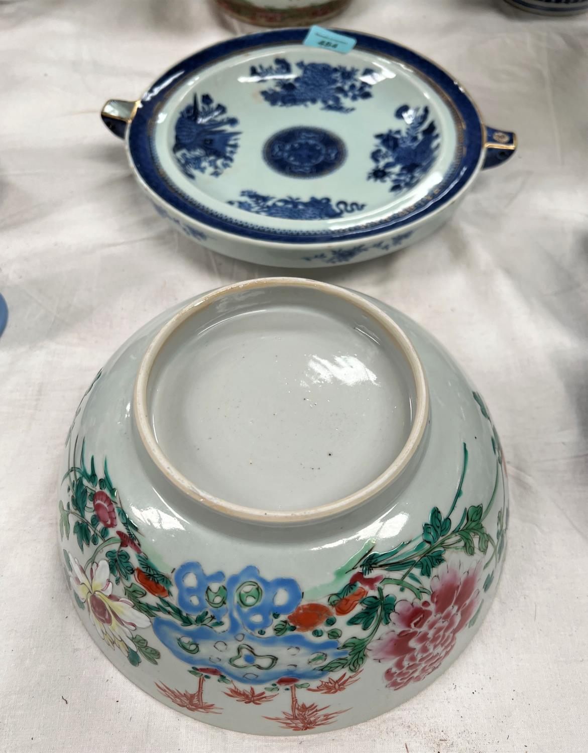 A large Chinese famille rose bowl, 23.5cm; a Chinese blue and white warming dish dia. 29cm (both