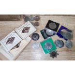 A selection of commemorative crowns and other coins; silk and other postcards; photos; etc.
