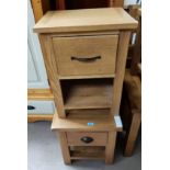 Two modern light wood bedside tables with single drawer