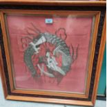 A pair of Chinese dragons in silvered embroidery, 50 x 46cm, framed and glazed