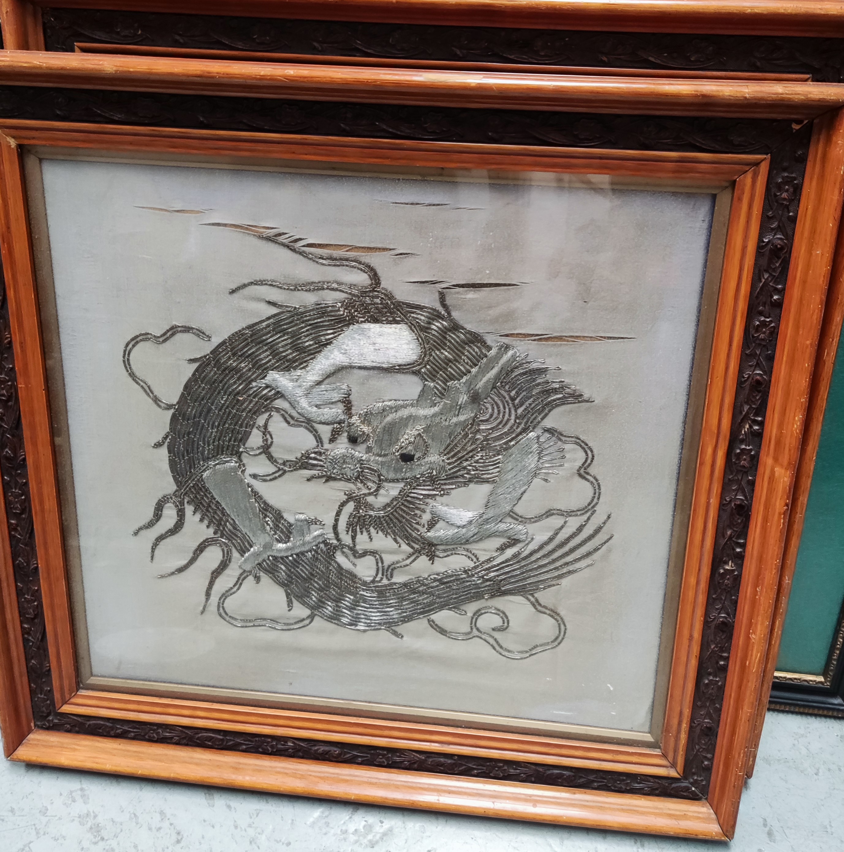 A pair of Chinese dragons in silvered embroidery, 50 x 46cm, framed and glazed - Image 2 of 2