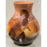 A modern Moorcroft 'Dinosaur' vase of bulbous form decorated with dinosaurs in a desert setting,