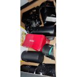 A Pentax SLR, various lenses, flash etc