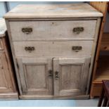 A Victorian stripped pine side cabinet with double doors and double drawers ht. 108 x 85 x 51cm deep