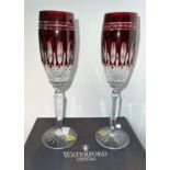 A boxed pair of Waterford overlaid and cut glass ruby champagne