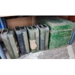 Four vintage petrol cans; a tin trunk