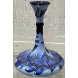 A modern Moorcroft vase of squat form, with slender neck, decorated in 2 tone blue in the