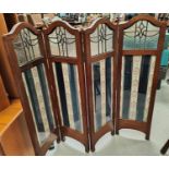 A 1930's mahogany 4 fold fire screen with leaded glass upper panels
