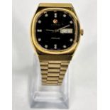 A Gent's gold plated stainless steel RADO automatic wristwatch Swiss movement, black diamond dot