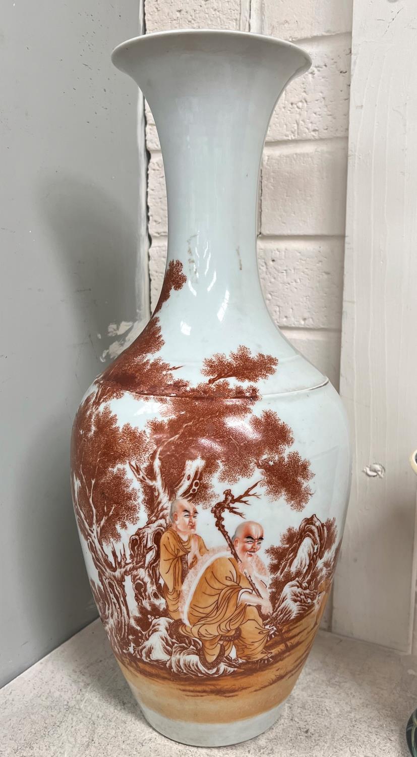 A Chinese vase with burnt orange decoration of monks in a country scene with text to other side, 6