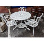 A Victorian style cast metal garden table with circular top, and 3 chairs