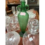 An unusual green glass vase with double handles and tapering shape; two etched decanters and
