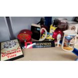 A selection of Guinness and other pub signage; a Robinson's jug, others similar