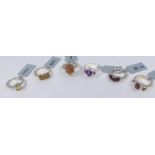 Six silver rings set with semi-precious stones:- Tocantin Garnet 1.6 carat; Rhodolite Garnet & White