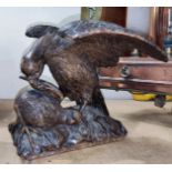 A Black Forest carving of a bird of prey eating smaller bird, height 19cm