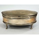 A hallmarked silver oval trinket box with beaded border and hinged lid, on 4 cabriole legs,