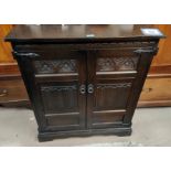 An Old Charm oak double carved door side cabinet