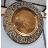 A large brass wall handing Eastern dish/table top with stand, dia. 76cm