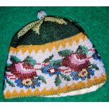 A 19th century beadwork cosy or cap with floral decoration etc 10cm