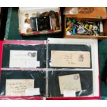 A selection of stamps on original envelopes; ; badges; costume jewellery etc.