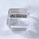 An 18 carat hallmarked gold half eternity ring set 7 diamonds, each 4 mm diameter approx, 3.1gm