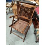 An unusual folding stick back chair with Bergere seat (a.f) purportedly for a ship's deck
